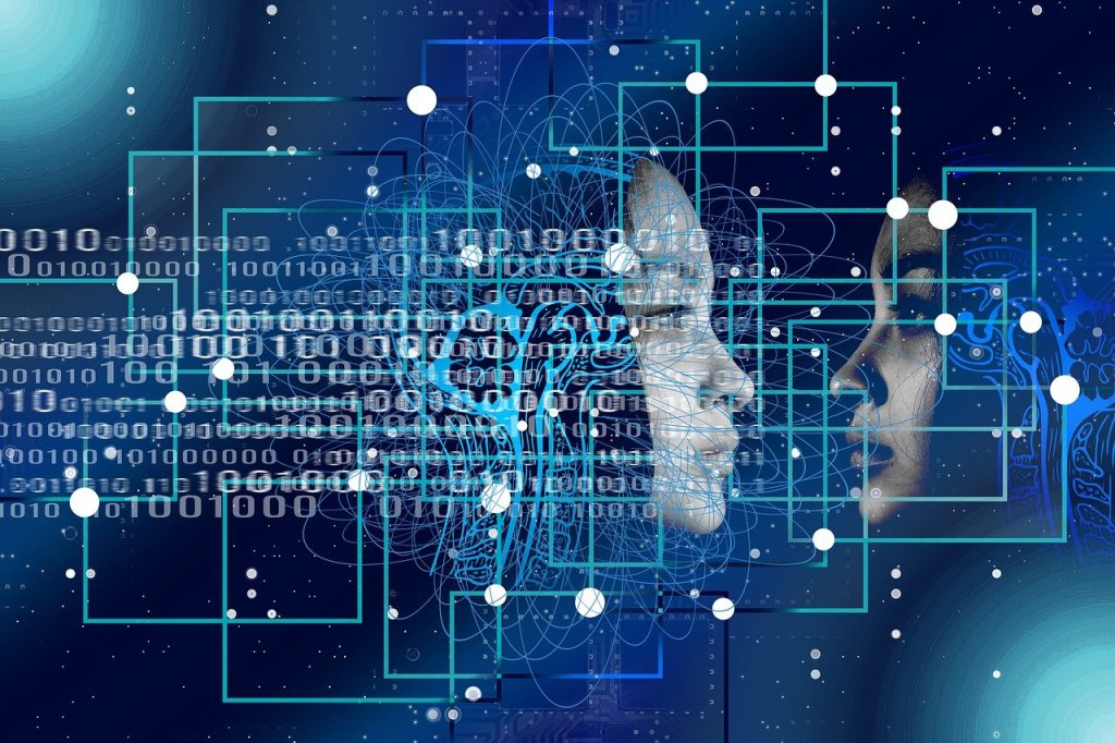 Image of two faces staring at one another behind a binary code of data.
Image via Pixabay.